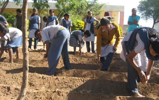Students (7th - 10th standard) of Shree Baleshwar Anudanit Primary and Secondary Ashram School, Maharashtra State, India, develop vegetable garden for reuse of treated water. Source: SEECON (2010)